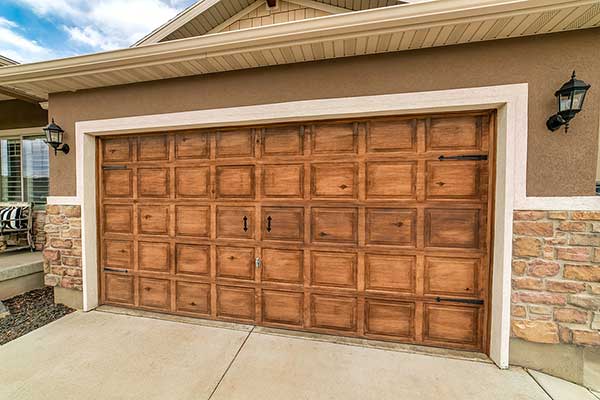 Two Black Garage Doors With Window Panels And Wall Lighting garage door repair Oak Lawn Illinois