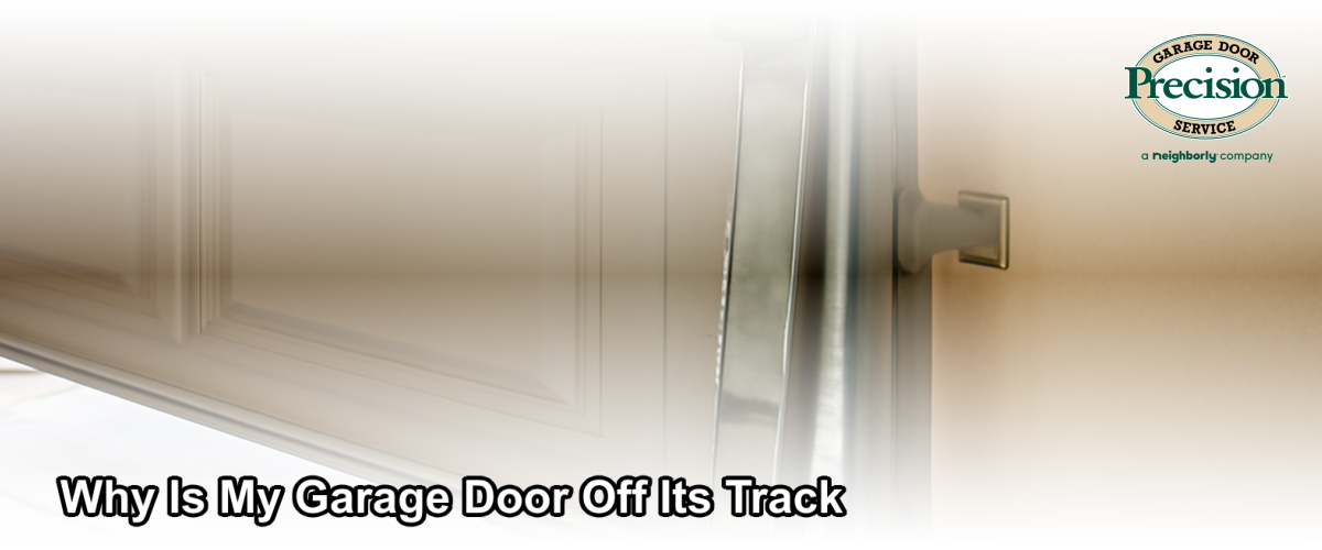 Close-up of a residential garage door that has come off its metal track, with the roller visibly displaced, photographed in a Ventura California home garage.