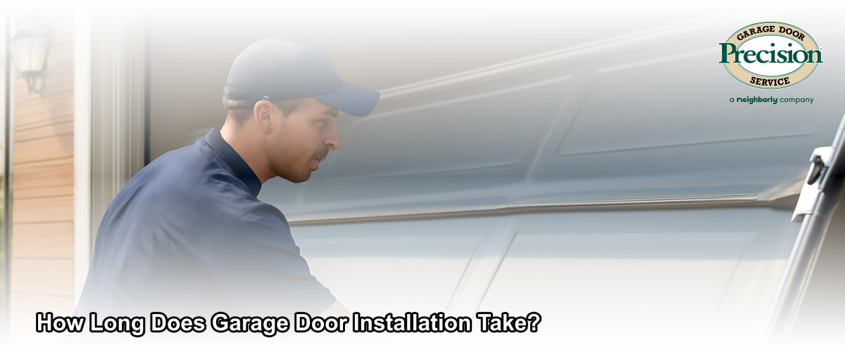 Professional technician installing a new garage door panel on a residential home in Ventura, California